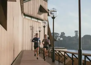 a couple jogging by the dock